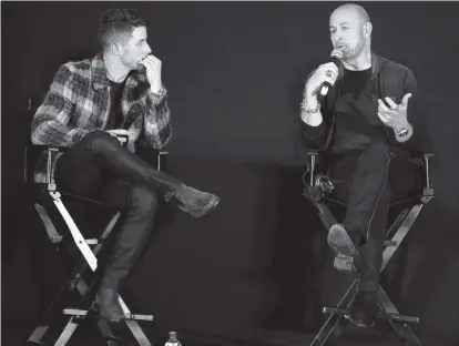  ?? ALEXANDER TAMARGO Getty Images for Revlon ?? Nick Jonas, left, with designer John Varvatos in a promotiona­l appearance at Aventura Mall.