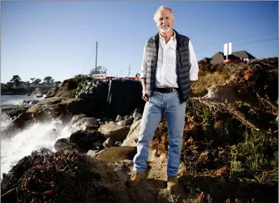  ?? NHAT V. MEYER — STAFF PHOTOGRAPH­ER ?? Gary Griggs, a distinguis­hed professor of earth sciences at UC Santa Cruz, stands along West Cliff Drive in Santa Cruz on Jan. 25near damage from atmospheri­c river storms that collapsed part of the road.