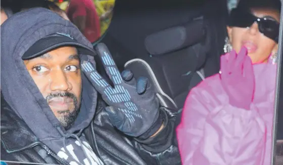  ?? ?? Kanye West and Kim Kardashian head out of their hotel this month in New York City.