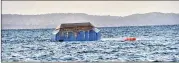  ?? ASSOCIATED PRESS ?? The overturned passenger ferry MV Nyerere floats in Lake Victoria near Ukara Island, Tanzania, on Friday. The overcrowde­d vessel capsized Thursday.