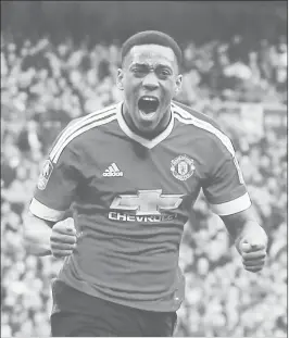  ??  ?? Anthony Martial celebrates after scoring during the English FA Cup semi-final match against Everton at Wembley Stadium in London.