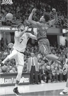  ?? AP Photo/Tony Dejak ?? ■ Cleveland Cavaliers’ Collin Sexton (2) loses control of the ball next to Los Angeles Lakers’ JaVale McGee (7) during the first half Wednesday in Cleveland.