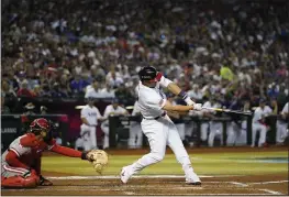  ?? GODOFREDO A. VÁSQUEZ – THE ASSOCIATED PRESS ?? The United States' Mike Trout hits a three-run home run during the first inning of Monday's World Baseball Classic game against Canada in Phoenix.
