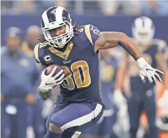  ?? MATTHEW EMMONS/ USA TODAY SPORTS ?? Los Angeles Rams running back Todd Gurley ( 30) runs with the ball against the Dallas Cowboys at AT& T Stadium last Sunday.