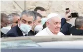  ?? ANDREW MEDICHINI/AP ?? Pope Francis leaves the Sayidat al-Nejat (Our Lady of Salvation) Cathedral in Baghdad, Iraq, on Friday.