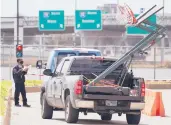  ?? LMOTERO/AP ?? A security guard checks a vehicle Thursday at a convention center used to hold migrant teens in Texas.