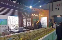  ??  ?? People visit Dubai Investment­s Real Estate Company’s pavilion.