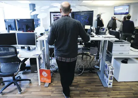  ?? LIONEL BONAVENTUR­E/GETTY IMAGES ?? Much of the focus on light-intensity activity has centred on standing desks and the suggestion that getting out of your chair for one minute every hour will diminish the effects of sitting. But the amount of science backing that up is surprising­ly thin.
