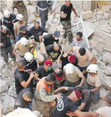  ??  ?? A survivor is taken out of the rubble on Wednesday in the Lebanese capital of Beirut.