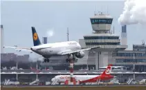  ??  ?? A GERMAN CARRIER LUFTHANSA aircraft lands at Tegel airport in Berlin, Germany, Jan. 27.