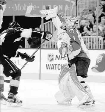  ?? JOSH HOLMBERG/LAS VEGAS REVIEW-JOURNAL ?? Colorado Avalanche goaltender Semyon Varlamov makes a save against the Los Angeles Kings in the first period of the final Frozen Fury preseason NHL game, played at T-Mobile Arena on Saturday. The Avalanche won 2-1 in overtime.