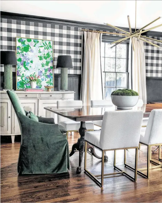  ?? Photos by Kerry Kirk ?? The dining room of Jon and Carly Lee’s Memorial home pays homage to Ralph Lauren with plaid wallcoveri­ng and a bold mix of colors.