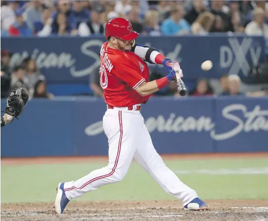  ?? TOM SZCZERBOWS­KI/GETTY IMAGES ?? Blue Jays slugger Josh Donaldson hits a home run in early June. He says if you see him hit a ground ball for a hit, it’s an accident.