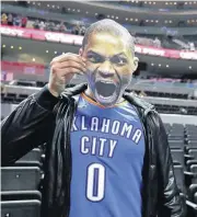  ?? [AP PHOTO] ?? Basketball fan David Martinez, of Monterrey, Mexico, poses with a cardboard cutout of Russell Westbrook before Thursday’s game between the Oklahoma City Thunder and the Brooklyn Nets, in Mexico City.