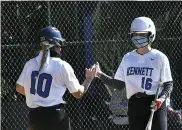  ?? BILL RUDICK — FOR MEDIANEWS GROUP ?? Kennett’s Genevieve Ebaugh and Sara Burns high five after Ebaugh scored on Monday.