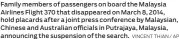  ?? VINCENT THIAN / AP ?? Family members of passengers on board the Malaysia Airlines Flight 370 that disappeare­d on March 8, 2014, hold placards after a joint press conference by Malaysian, Chinese and Australian officials in Putrajaya, Malaysia, announcing the suspension of...