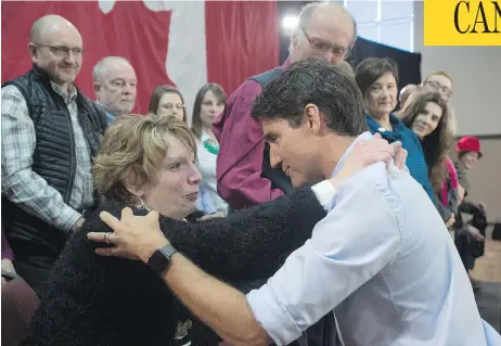  ?? ADRIAN WYLD / THE CANADIAN PRESS ?? Kathy Katula, from Buckhorn, Ont., left, took Prime Minister Justin Trudeau to task for the hardships brought on by the rising costs of electricit­y.