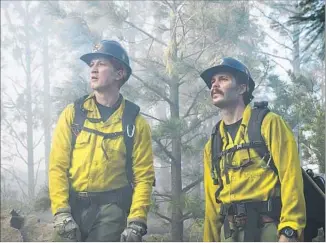  ?? Columbia Pictures ?? “ONLY THE BRAVE” features Miles Teller (left, with Taylor Kitsch) as a real-life heroin addict who gains redemption by joining an Arizona firefighti­ng crew, the Granite Mountain Hotshots.