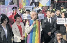  ?? AFP ?? Veteran gay rights activist Chi Chia-wei speaks to the media with his supporters in front of the Judicial Yuan in Taipei on Thursday.