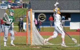  ?? THOMAS NASH — DIGITAL FIRST MEDIA ?? Pope John Paul II’s Kyle Donovan, right, celebrates after scoring a goal against Methacton Tuesday.