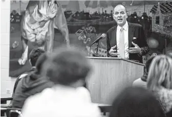  ?? Photos by Josie Norris / Staff photograph­er ?? Robert Chavez, president and CEO of Hermès of Paris, addresses students Wednesday during his visit at his alma mater, Luther Burbank High School in San Antonio.