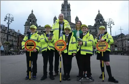  ??  ?? Maria Louise Stewart, 11, of St Maria Goretti Primary, Ross McGinty, 10, from Sunnyside Primary, Darcey Fullarton, 11, from St Benedicts, Reece Mullen, 10, from St Francis Primary and Cara Gilfillan, 10, from St Charles Primary with Road Safety Officer Alan Barclay and Councillor Anna Richardson Pictures: Kirsty Anderson