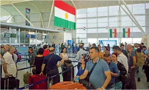  ?? AP ?? Anxious passengers queue up to check in at the Erbil Internatio­nal Airport before flight ban. —