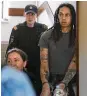  ?? AP ?? WNBA star and Olympic gold medalist Brittney Griner is escorted to a courtroom in Khimki, Russia, on Monday.