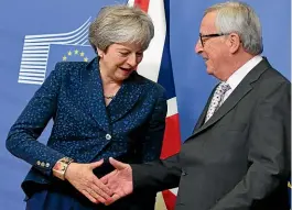  ?? AP ?? European Commission President JeanClaude Juncker shakes hands with British Prime Minister Theresa May before a meeting on Brexit at EU headquarte­rs in Brussels.