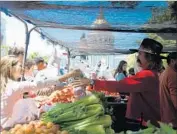  ?? Los Angeles Times ?? FARMER TONY Mellow sells produce in 2014 at San Francisco’s Heart of the City Farmers Market, where shoppers can make purchases with food stamps.