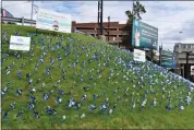  ?? PHOTO BY KAITY ANDREY, MISSION KIDS ?? Pinwheels honor 1,326child abuse survivors in a garden planted at Norristown Transporta­tion Center, April 5, 2024.