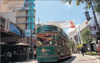  ?? Michael Robinson Chavez
Los Angeles Times ?? THE GROVE
mall serves as a focal point for David Ulin’s stroll around L.A. in “Sidewalkin­g.”