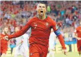  ?? FRANCISCO SECO/ASSOCIATED PRESS ?? Portugal’s Cristiano Ronaldo celebrates the first of his three goals during a 3-3 draw against Spain on Friday.