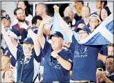  ??  ?? Scotland fans cheer on the stand before the start of the Rugby World Cup Pool A game at Kobe Misaki Stadium between Scotland and Samoa in Kobe, western Japan on Sept 30, 2019. Japanese
characters on their T-shirts read:
‘Scotland’. (AP)