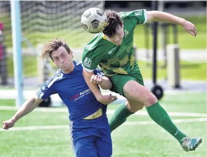  ?? PHOTO: PETER MCINTOSH ?? Headed off . . . Green Island player Cam Brewitt gets to the ball before his Mosgiel opponent Rhys Quarrell in a Football South promotionr­elegation game at Logan Park on Saturday.