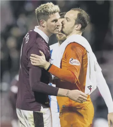 ??  ?? 0 Goalkeeper Jamie Macdonald consoles anguished Kyle Lafferty, having just saved his penalty.
