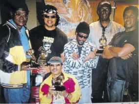  ??  ?? Toots Hibbert (third right), frontman of Toots and the Maytals, with his band members (from left) guitarists Radcliffe “Douggie” Bryan and Carl Harvey, drummer Paul Douglas (stooping), bass player Jackie Jackson and keyboardis­t Charles Farquharso­n and their Grammy Awards days after the presentati­on ceremony in Los Angeles, California, in 2006.