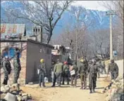  ?? PTI ?? CRPF jawans stand guard at Nigeen Pora during an encounter in Tral on Sunday. A police constable was killed in the operation.