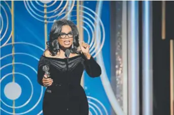  ?? Paul Drinkwater, NBC via The Associated Press ?? Oprah Winfrey accepts the Cecil B. DeMille Award for lifetime achievemen­t Sunday at the 75th Annual Golden Globe Awards in Beverly Hills, Calif.