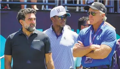  ?? SETH WENIG AP ?? Saudi Arabia's PIF chief Yasir Al-rumayyan (left) and Golf Saudi CEO Majed Al-sorour (center) stand with Greg Norman.