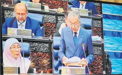  ??  ?? A live television feed shows Dr Mahathir delivering his winding-up speech.