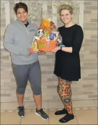  ?? Larry McGuire/The Punxsutawn­ey Spirit ?? Pictured is Pastor Leah Kovarik (right) and her helper Madi Vogan showing off the door prize that will be given away during the First Church of God’s annual Trunk or Treat on Saturday from 6 to 8 p.m.