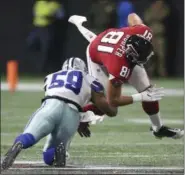  ?? JOHN BAZEMORE — THE ASSOCIATED PRESS ?? Falcons tight end Austin Hooper makes a catch ahead of Cowboys middle linebacker Anthony Hitchens (59) during the first half Nov. 12 in Atlanta.