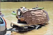  ?? Photos by Spencer Lahr, Rome News-Tribune ?? BELOW: Rome High’s BEAR Club beaver barge is backed into the Etowah River at Dixon Landing.