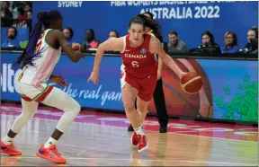  ?? ?? The Associaed Press
Canada’s Bridget Carleton, right, goes past Mali’s Maimouna Haidara during their Tuesday game at the women’s Basketball World Cup in Sydney, Australia.