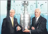  ?? BRUCE BENNETT — GETTY IMAGES ?? Hall-of-Fame inductee Mark Howe poses along with his father Gordie Howe (right) at the Hockey Hall Of Fame in Toronto, Ontario, Canada in 2011.