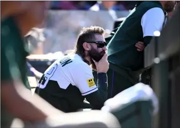  ?? HELEN H. RICHARDSON — THE DENVER POST ?? The Rockies’ Charlie Blackmon watches the game from the dugout during the team’s final home game of the regular season at Coors Field in Denver on Sunday. The Rockies lost to the San Diego Padres 13-6.