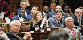  ?? BOB ANDRES / BANDRES@AJC.COM ?? Rep. Meagan Hanson, R-Brookhaven (center), watches the vote board as SB 17 passes the Georgia House. The House passed the “Brunch Bill,” allowing localities to vote on 11 a.m. Sunday alcohol sales. Peachtree Corners approved its referendum, but no other results were available at press time.