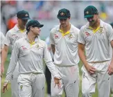  ??  ?? The Aussies walk off upbeat despite a long day at the office.