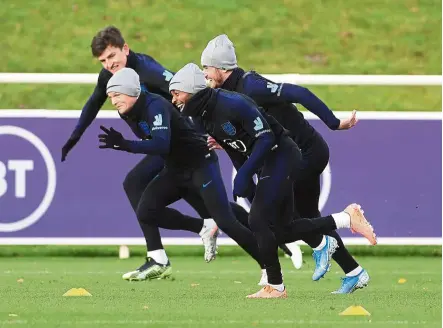  ?? — aP ?? Hard at work: england players in action at a training session at st George’s Park on Tuesday.